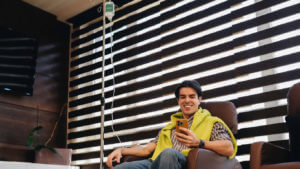 Man receiving intravenous vitamin therapy in