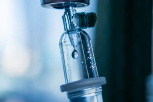 A close-up image of a medical intravenous (IV) drip used for therapy in hospitals for gastrointestinal (GI) patients.